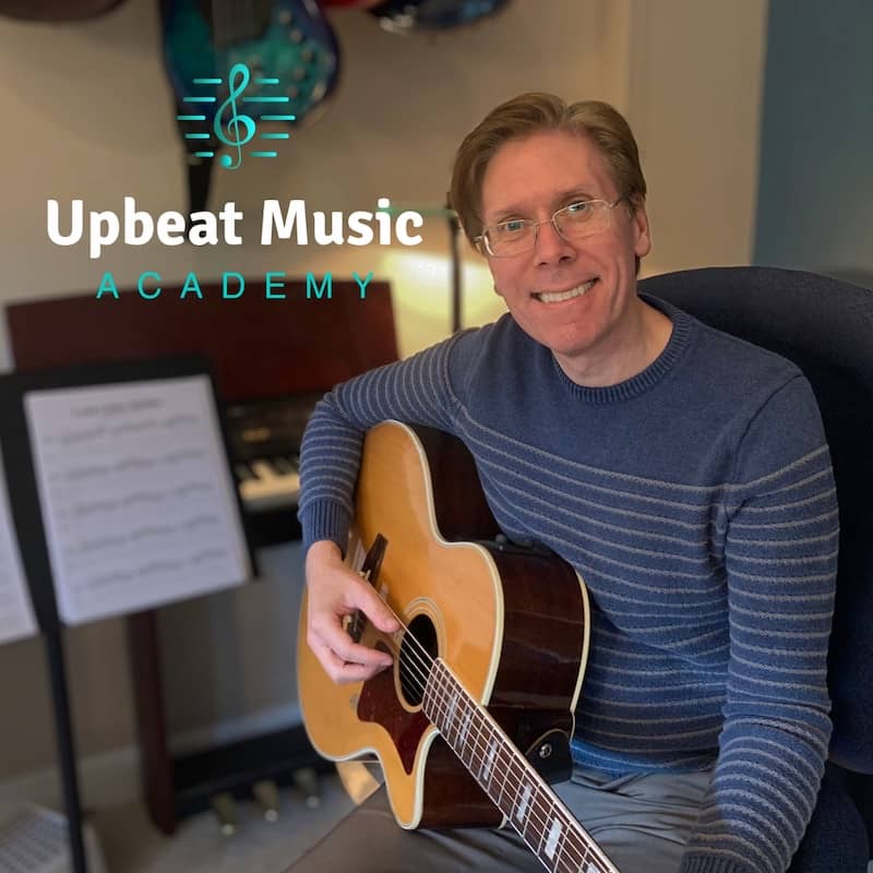 Noel Wentworth guitar teacher at the Upbeat Music Academy Kelowna Noel Wentworth teaching a guitar student