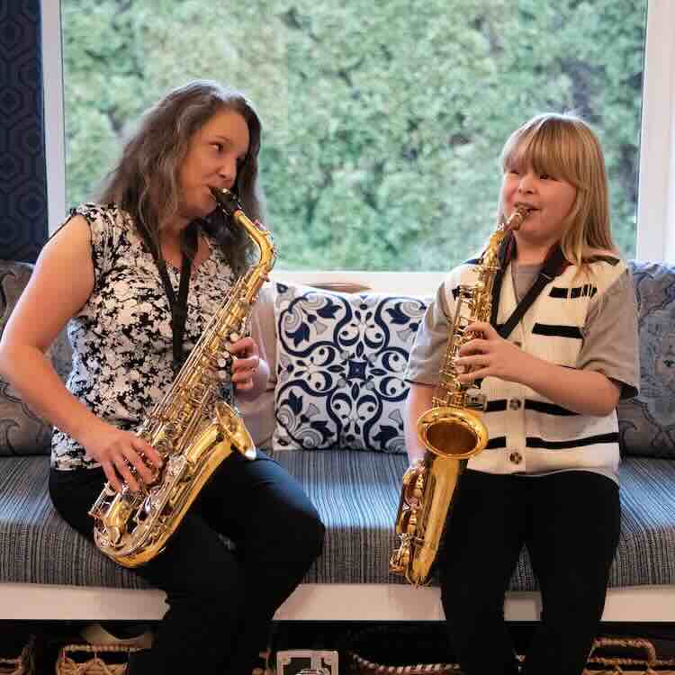 Saxophone Lessons Kelowna with Lora Wentworth at the Upbeat Music Academy Kelowna Students performing their saxophones in a Concert